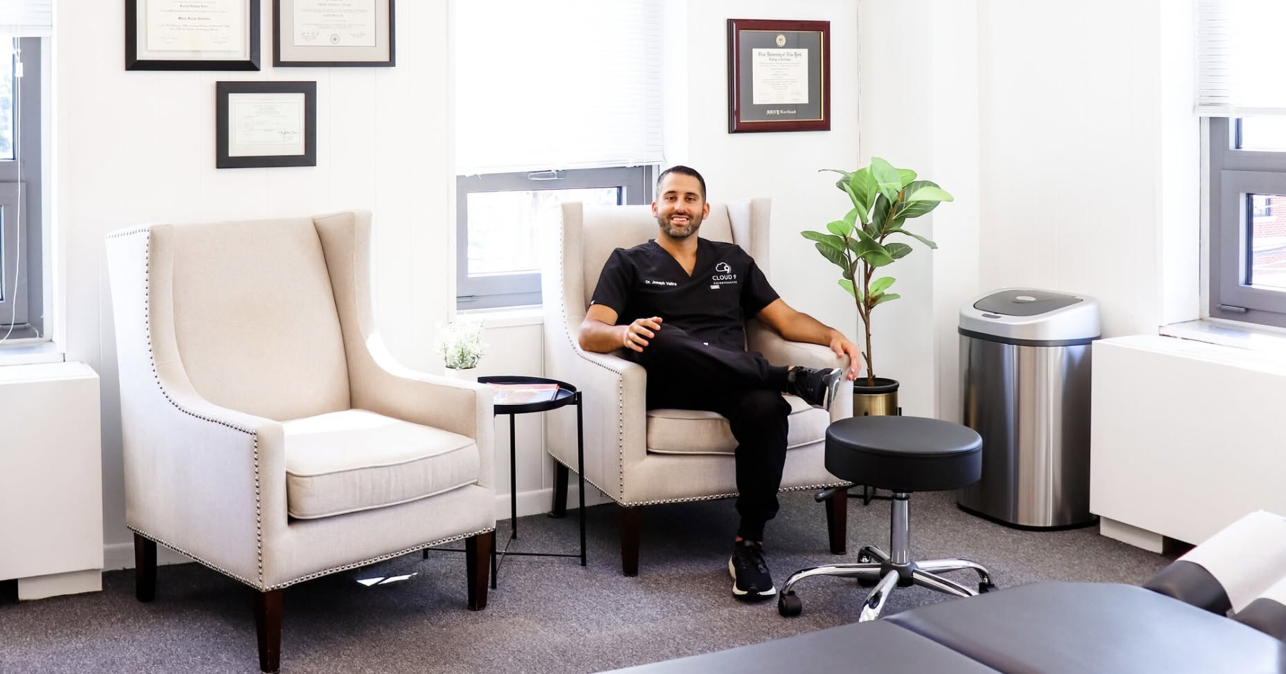 Dr. Joseph Veltre seated in the Cloud 9 Chiropractic office